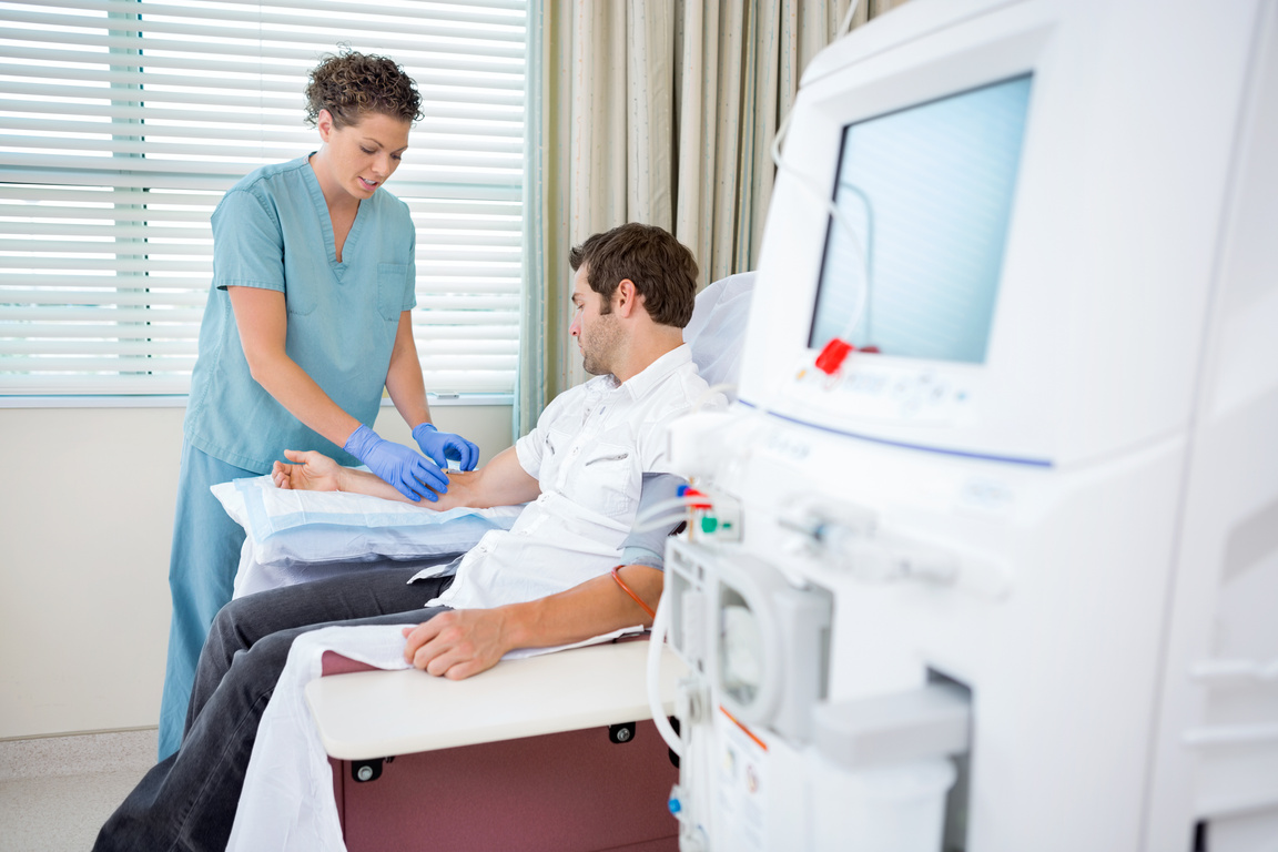 Nurse Injecting Patient for Renal Dialysis Treatment