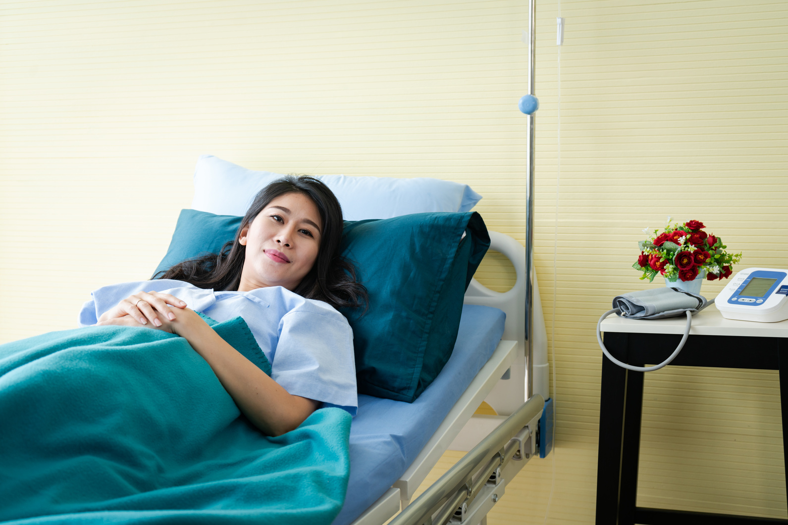 Smiling female patient in bed